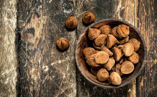 Chocolate truffles in a bowl. photo