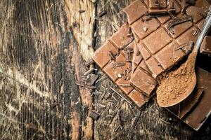 Chocolate bars with cocoa powder. photo