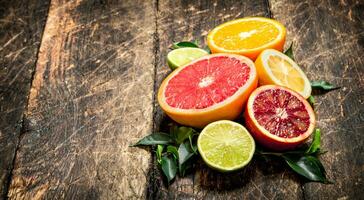 Citrus background. Fresh citrus fruits - Lemons, oranges, limes, grapefruits. photo