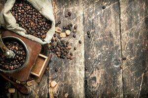 Coffee grinder with coffee beans. photo