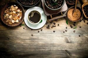 Fresh coffee in a cup with an old hand grinder. photo