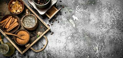 Coffee background. Welded coffee in a Turkish with sugar, cinnamon and coffee beans. photo