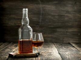 French cognac with a cigar. photo