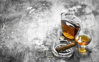 French cognac with a cigar. photo