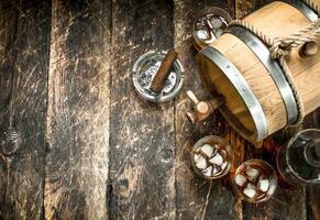 barrel of Scotch whiskey with a glass. photo