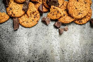 Oatmeal cookies with chunks of chocolate. photo