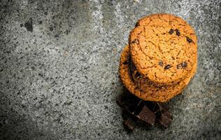 Oatmeal cookies with chunks of chocolate. photo