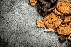 Oatmeal cookies with chocolate in a bowl. photo