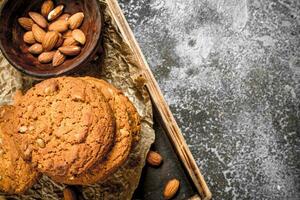 Oatmeal cookies in a bowl with nuts. photo