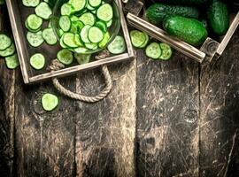 Fresh cucumbers in an old box. photo