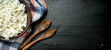 Fresh cottage cheese in a bowl. photo