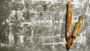 Baking background with the rolling pin with flour. photo