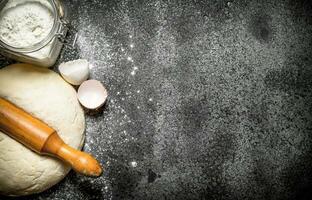 Dough background. Pastry with ingredients on rustic background. photo