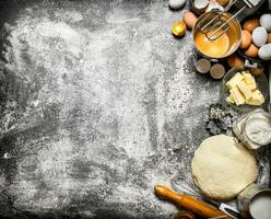 Dough background. The dough with the mixer and various ingredients . photo
