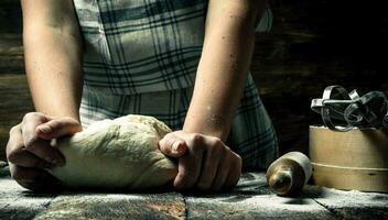 Dough background. Preparation of dough with tools. photo