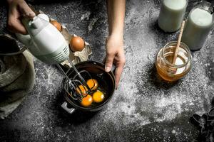 Dough background. A woman is preparing a fresh dough. photo