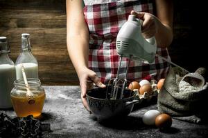 Dough background. A woman is preparing a fresh dough. photo