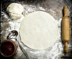 Roll out dough for pizza. photo