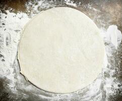 Roll out dough for pizza. photo