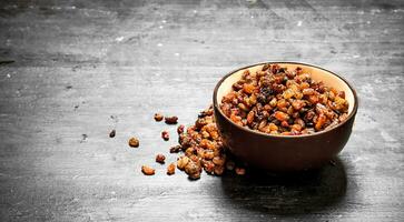 Raisins in a bowl . photo