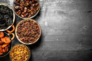 Dried fruits in bowls. photo