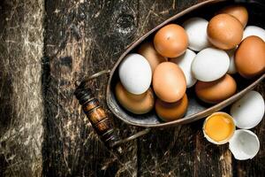 Fresh eggs in a bowl. photo