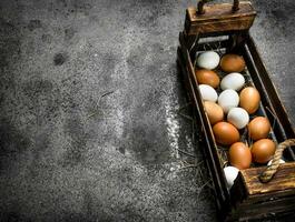 Fresh eggs in an old box. photo