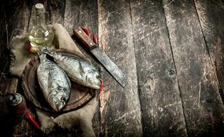 Raw Dorado fish with hot chili peppers. photo