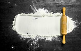 Flour with rolling pin. photo