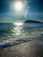 photo of a beach in Turkey in Alanya on a beautiful summer day stylized as an old photographA beautiful photo of a beach in Turkey in Alanya on a beautiful summer day stylized as an old photograph