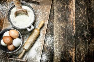 Flour with fresh eggs. photo