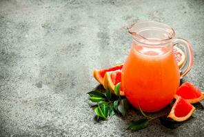 Fresh juice from grapefruits. photo