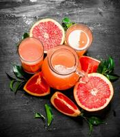 Fresh juice from grapefruits. photo