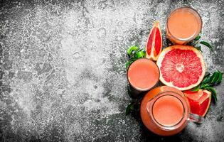 Fresh juice from grapefruits. photo