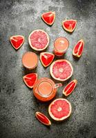 Fresh juice from grapefruits. photo