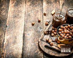 Nut butter with chocolate and hazelnuts. photo