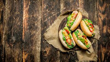 Street food. hot Dogs with herbs, vegetables and hot mustard. photo