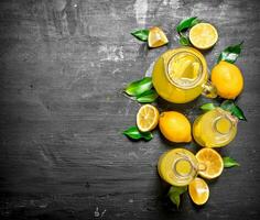 Cold fresh lemonade with slices of ripe lemons. photo