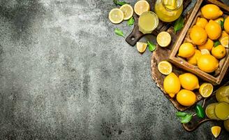 Fresh lemonade from ripe lemons in the box. photo