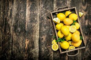 Fresh lemons on an old tray. photo