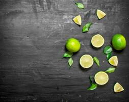 Fresh limes with green leaves. photo