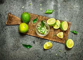 Zest lime slices on the old Board. photo