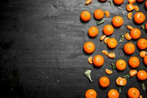 Ripe tangerines with green leaves. photo