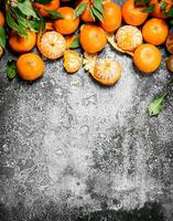 Fresh tangerines with leaves. photo