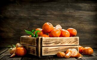 Ripe mandarins in an old box. photo