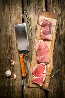 Fresh steak from raw meat and spices and chopping knife. photo
