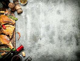 Meat grill. Fried steak of pork with red wine and spices. photo