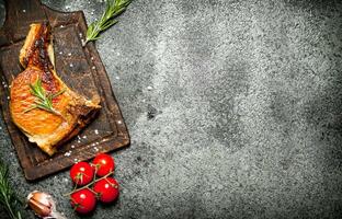 Meat grill. Fried piece of meat with spices on a rustic background. photo