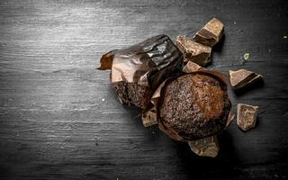 Chocolate muffins with chunks of chocolate. photo