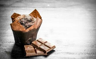 Chocolate muffins with chunks of chocolate. photo